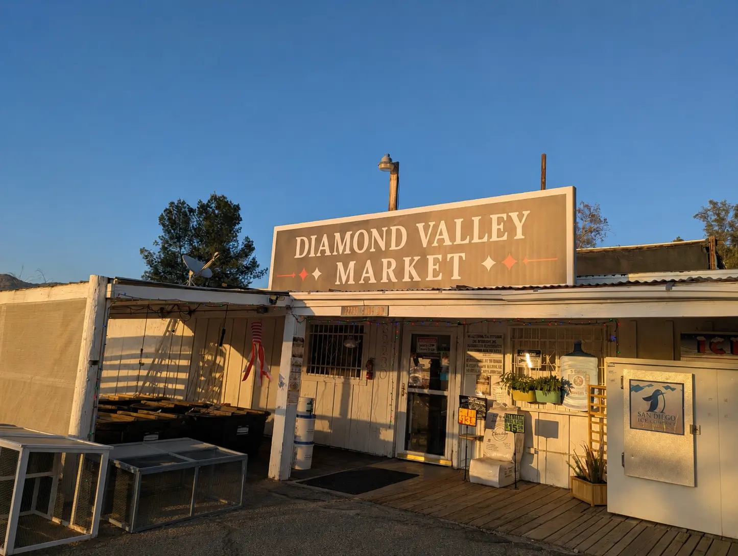 Diamond Valley Market storefront on Sage Road in warm evening light
